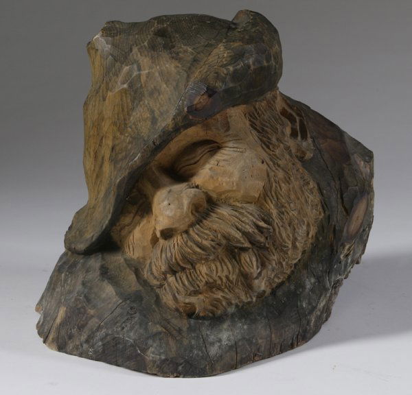 Franz Zelezny, German (1866 - 1932), Wood Carving: Modeled as a Tyrolean mountain man a sleep, hand carved from one large wood fragment, 12-1/2" L x 8-1/2" W x 10" H. Shrinkage fracture in the back with 1/4" separation, minor wear from cleaning, no ot