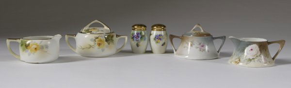Collector's Lot of 6 Hand Painted Porcelain Table: Very nice yellow rose and gilt decorated Nippon creamer and sugar bowl, together with a floral decorated Bavarian creamer and sugar bowl and a floral decorated salt and pepper shaker. There is a small