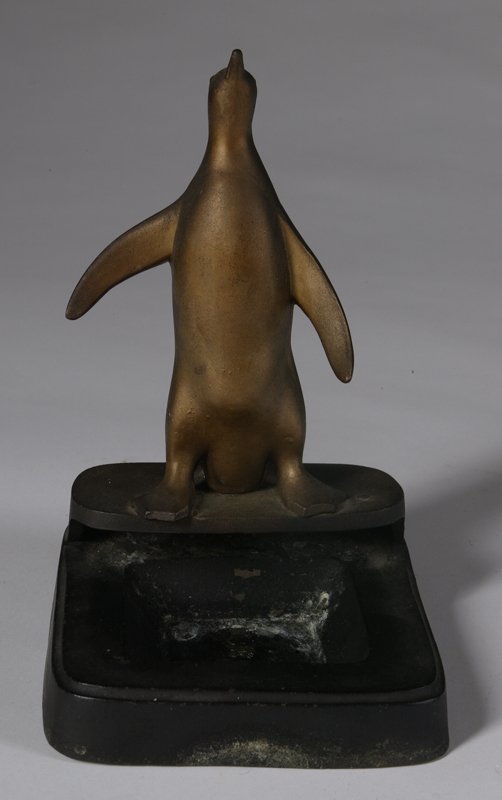 C/1930 Frankart Figural Penguin Ashtray: Gilt and black lacquer on spelter, signed in the well, 8" H overall (some paint loss from ashtray use, minor corrosion on back bottom edge).