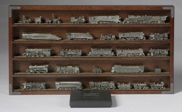 Franklin Mint "The World's Greatest Locomotives": Cirac 1985, pewter set, includes the "Mallard, "French TGV, "Big Boy", "Juipter", "John Bull", and various other locomotives, comes with carved wood shelf with inset train tracks on each shelf and pap
