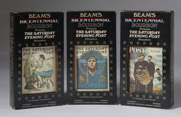 3 Norman Rockwell Bicentennial Decanters: Includes "Pioneer Saturday Evening Post", "What Our Fourtune Saturday Evening Post", and "Ye Pipe And Bowl Tavern Saturday Evening Post", each in orginal box. Minor surface dirt on the boxes.