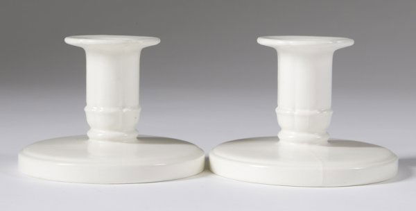 Pair of 1940 Keith Murray Wedgwood Candlestick: Made in England, the circular off-white ceramic candlesticks measure 3" H x 4.25" Dia. Signed on bottom; excellent condition.