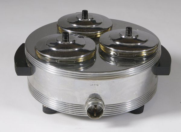 Chase Food Warmer with Pyrex Glass Inserts: Round form with 3 compartments with round painted black lids with painted wood handled raised on four black painted round turned wood legs, 7"H x 14"D. Minor surface scratches on the surface from norm