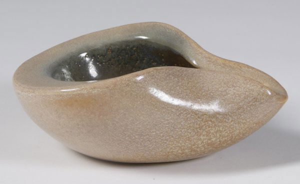 Rare Signed Russel Wright Lip Form Ashtray: Unique form, tan sponge form design with green and black painted designs inside, 2.75"H x 6.5"W x 4.5"D; signed on bottom.