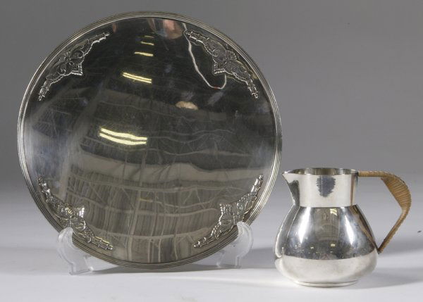 Lurelle Guild Int. Creamer & Rogers & Son Plate: Art Deco wicker handle International silverplated creamer, 4.5"H, signed on the bottom, together with W.M. Rogers & Son plate with 4 applied scrolling decoration raised on round base, 10.5"D, signed o