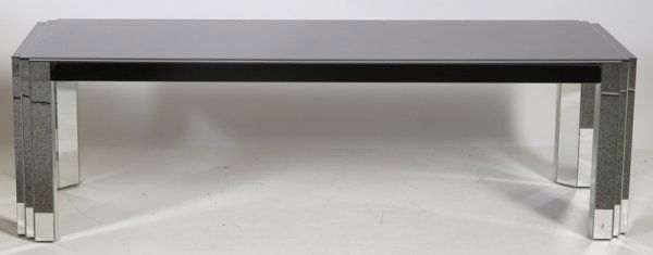 Contemporary Art Deco Style Coffee Table: Graduated black mirror top raised on 3 sectional mirrored sides, 20"H x 66"W x 20"D. Surface scratches from normal use and one of the legs has been cracked.