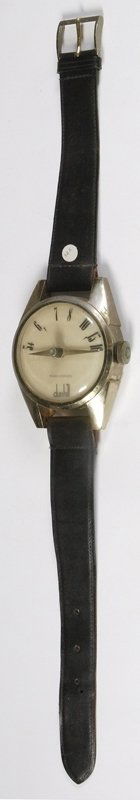 Vintage Large Dunhill Wristwatch Radio: Unique watch collector's item, leather style band plastic body construction. Numbers on top half of face for tuning, tuning knob on right. Center knob to rotate dials. Made in Japan, 31"L. There are s