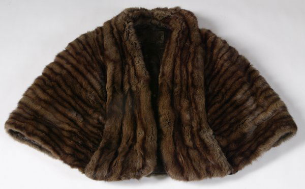 Ladies Vintage Mink Stole: Circa 1950's Mink Stole/Wrap from Hudson's in Detroit. Chocolate and dark brown, stole has brown silk lining with small flowers. Full collar all the way to bottom. One pocket inside with label that sa