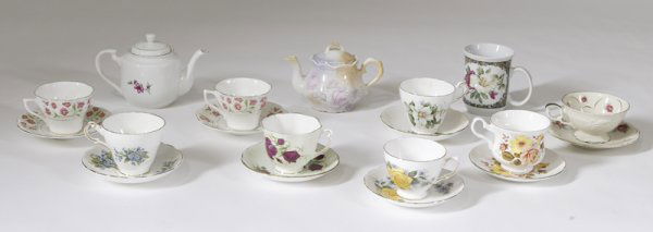 19 Pieces of Porcelain: Comprising of 2 floral decorated teapots together with 8 cups and saucers with floral patterns from various makers; Crownford, Regency, Royal Vale etc. Together with a Polish floral decorated coffee m