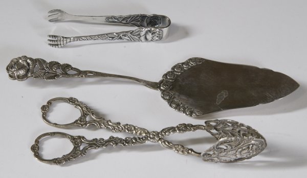 3 Piece Sterling Silver Appetizer Set: Including a large pair of tongs, small pair of tongs, and a cake server, each with intricately molded scrolling leaf and rose patterns. Good condition.