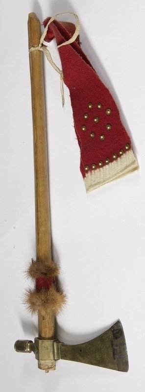 Brass Pipe Tomahawk with Haft: Dovetailed steel bit, fur decoration and trade cloth decorative drops. Tomahawk head 8". 20" overall legnth.