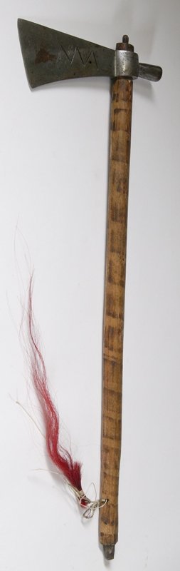 Pipe Tomahawk with File Burned Haft: Steel tomahawk head with incised zig-zag motif on the blade, overall length is 25" L.