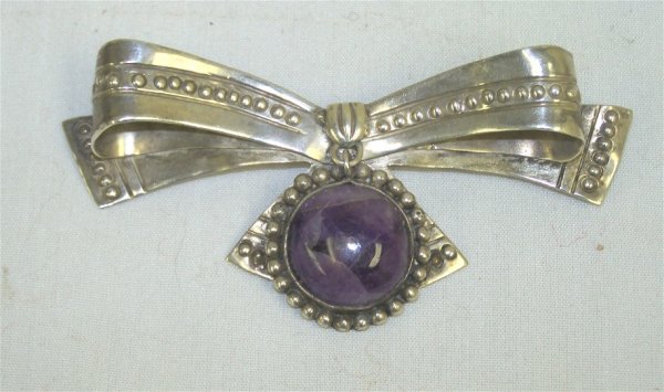 William Spratling Sterling & Amethyst Brooch: William Spratling (1900-1967) was an American-born silversmith and artist, best known for his influence on 20th century Mexican silver design. Taxco was a traditional site of silver mines, but had no 