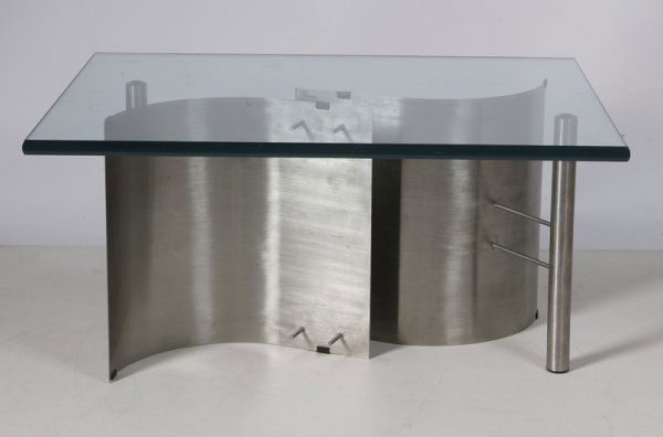 Custom Designed Modern Glass Coffee Table: Glass top set on 2 carved stainless steel sectional S-curved bases. Attached to two stainless steal rod legs, 14" H x 30" W x 24" D. Excellent condition.
