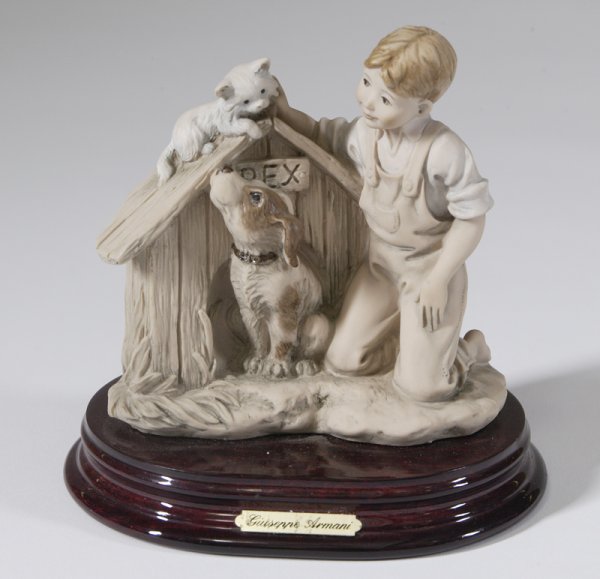 Guiseppe Armnai Porcelain Sculpture On Stand: Figure of a boy petting a cat on top of his pet dogs Rex's dog house, impressed "Guiseppe Armani D.T.L. N C 1993 Florence on the back, 5.5"H x 5"W. Good condition, does not include box.