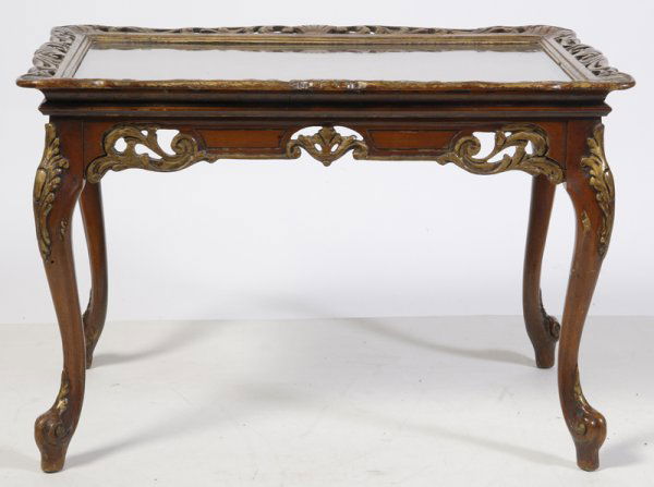 Antique Louis XV Style Coffee Table: Circa 1940's, coffee table is inlaid with floral and wheat decorations. Gold painted scrolling to sides and includes top glass with scrolled, wooden edges also painted in gold. Measures 20" H x 30" L