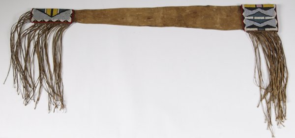 Plains Indian Beaded & Fringed Rifle Scabbard: Beaded on a red stroud in white, black, yellow, light blue, turquoise and pink. (Crow Indian?), Sinew sewn. 43" overall length. Condition: Bead work is excellent, some wear and staining on leather typ