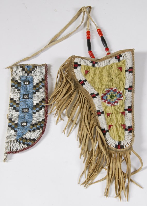 Plains Indian Beaded Pistol Holster & Knife Sheath: Early 20th C., fringed holster, fully beaded in white, yellow, red, blue, black and green beads, 10-1/2" with fringe. Knife sheath, fully beaded with various colors, 7" L. Condition: Holster is very n