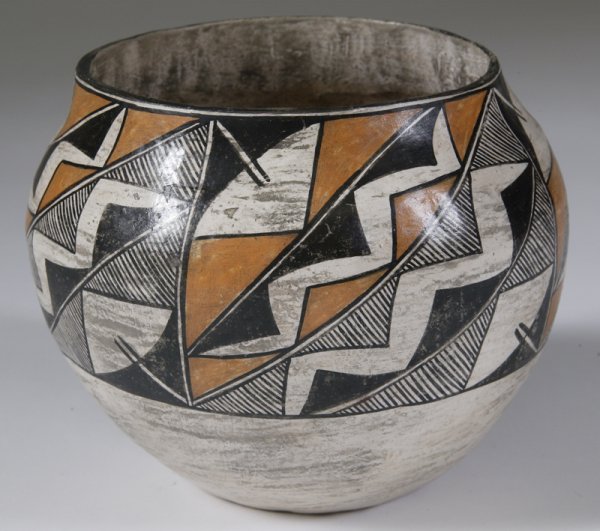 Acoma Pot, B. Ramirez: Acoma pot painted in white, black and orange geometric designs. 5.5" H x 5.5" Dia. Signed Acoma N.M. B. Ramirez. Minor paint loss.