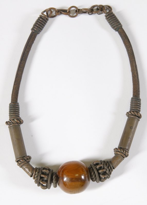 Antique African Choker Necklace, Lg. Amber Bead: Choker with large amber bead with brass beads on leather. Overall length is 14". Condition: Very fine with dark patina.