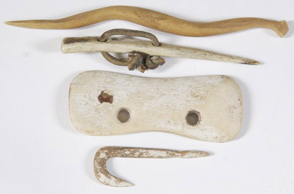 4 Primitive Bone Objects: Awl, gorget, snake form and fish hook. Longest is 6-1/2". Condition: All show age and usage.
