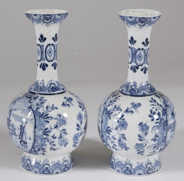 Pair of Mid. 19th C. Delft Vases: Each with sailboats and floral designs. One stands 12" H, has restoration to top and has glaze bubbles collected at the bottom. Other stands 11 & 7/8" H, leans and has glaze bubbles collected at the b