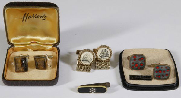 3 Pairs of Vintage Cufflinks & Tie Clip: Includes a boxed pair of Harrods tiger eye, carved with profile of a gentleman. A boxed pair of Eric Skoglund abstract cufflinks. A pair of ivory cufflinks, with scrimshaw of a sailing ship. Together