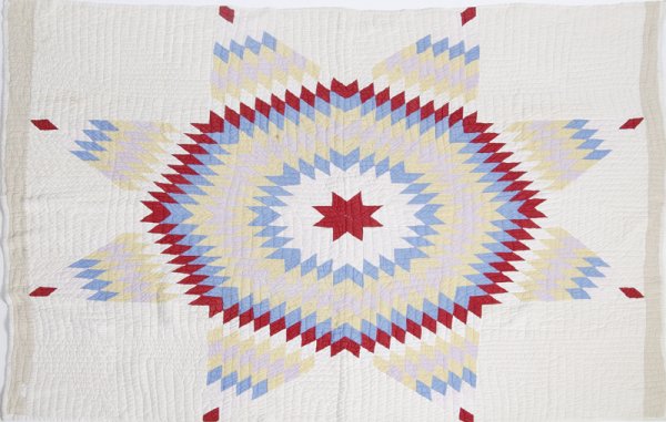 Late 19th/Early 20th C. Hand Sewn Star Quilt: Beautiful sewn quilt with large central star pattern. White/Off white with red, yellow, blue and pink. Tan border on top and bottom. 70" x 60"; minor staining, material loss in tan border (3"), and ce