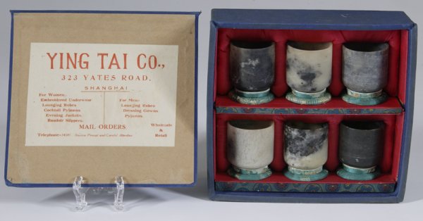 Boxed Set of Ying Tai Co. Marble Tea Cups: Each with a green Chinese silk stand, all are unique marble in black, white and gray. 2.5" H with stand, and in original box. Excellent condition. Estate of Meg Heinrich, Rochester Hills, MI.