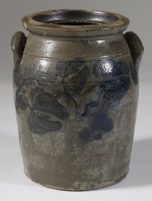 E. Fowler, Beaver, PA Cobalt Decorated Crock: Decorated in cobalt with flowers and vines, and around ear handles. 3 gallon crock. 13" H x 10" W. Surface with sporadic glaze losses, one handle with small chip underneath, base with 1/2" chip, stres