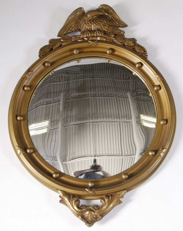 Late 19th/Early 20th C. Convex Gold Eagle Mirror: Antique convex "bullseye" mirror, made of wood, with eagle on top and looking to its' left. 30.25" overall heighth. Very minor wear consistent with age.