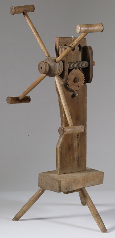 Circa 1800 Yarn Winder: Rests on three legs, has turned wood center with four turned winders. Put together with wood pegs and iron nails. 36" H; wear consistent with age and use. Collection from Pat Kimmel, Mt. Clemens, MI.