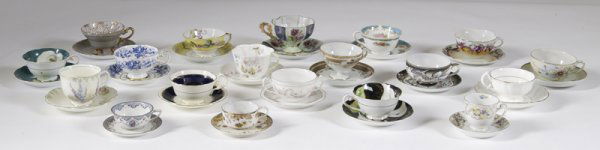 Large Lot of Porcelain Tea Cups and Saucers: Includes a Bavarian bullion cup and saucer with pink flowers and gilt lined. An Ansley cup and saucer decorated in cobalt, flowers and gilt. And a Tuscan cup and saucer decorated in flowers and gilt.