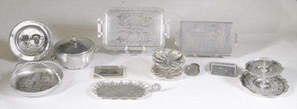 Lot of Vintage Aluminum Articles: Includes a covered Dutch oven with glass relish insert, 2 two-tiered serving dishes, large and small trays, plates and a bowl. All items have wear consistent with age and use. Collection from Pat Kimm