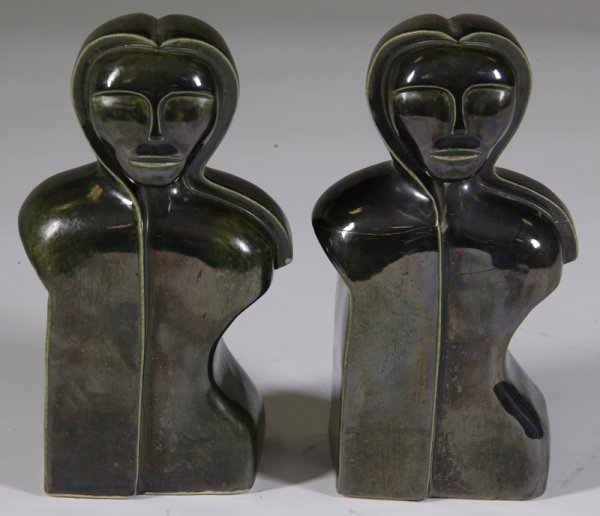 Pair of Vintage Alien Ceramic &Pottery Bookends: Each with torso and "alien" faces; shell is ceramic and filled interior with pottery, in dark green glaze. 7.25" H; crack to one with small chip on shoulder, other has been cracked and repaired, with 