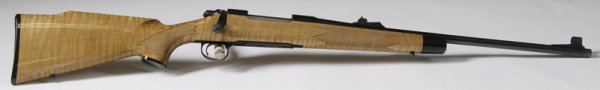 Remington Mod. 700BDL, 200th Anniversary: Ser. #C6805405, Cal. 30-06, 22" Barrel, Blued finish with Tiger Birch Stock, Raised Check piece, Floor plate engraved with a photo of Eilphalet Remington II 1793 - 1993, NIB with paperwork, never been