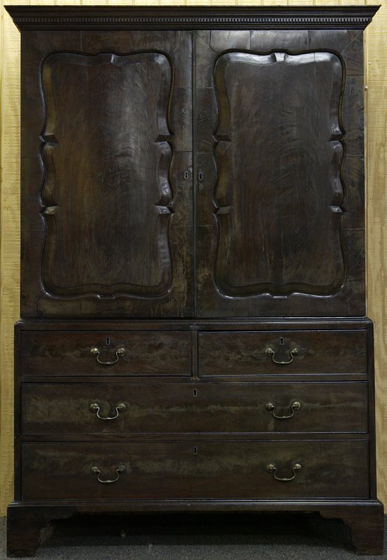 19th C. Linen Press: 19th C linen press with molded cornice above doors. Two small hand-cut dovetailed drawers above two long hand-cut dovetailed drawers. Raised on bracket feet. Inside has four shelves. One is open. Surf