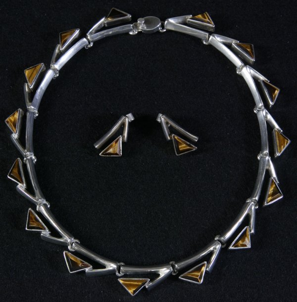 Sterling Silver & Tiger Eye Necklace & Earrings: Exceptional Mexican sterling silver and tiger eye stones demi parure of a choker style necklace and matching pierced earrings. Beautiful modernist design with bezel set tiger eye stones in a triangula