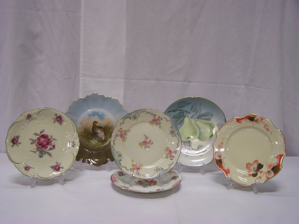 Lot of Six Decorative Bavarian Plates: Lot includes six Bavaria plates with floral, fruit and bird designs. Bird plate has hairline crack to bottom of plate otherwise all in good used condition.