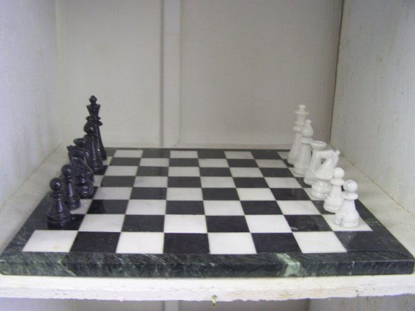 Marble Table Top Chess Set: Beautiful deep green and white marble chess set in original box .Complete with all pieces. Chess set measures 18" and would look very nice displayed on a coffee or game table. One stress crack to one