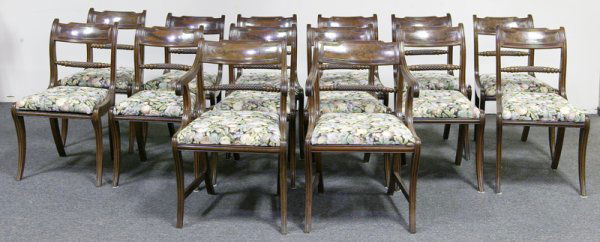 Fine Set of Fourteen Regency Dining Chairs: Very fine set includes twelve signed mahogany regency side chairs and two signed mahogany regency arm chairs. Carved diamond center splats. Floral and fruit seat cover. All with Drop-in seats and mold