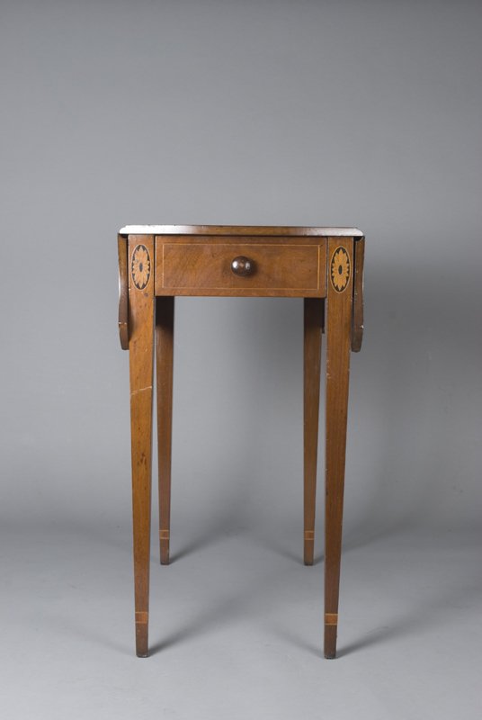 Kittinger Inlaid Drop Leaf Mahogany Pembrook Table: Reproduction of a late 18th C. table of Hepplewhite inspiration. Legs and drawers inlaid with floral design. One faux and one working drawer. 28.5" H x 26.75" L x 31" W (with leaves). Some scratching