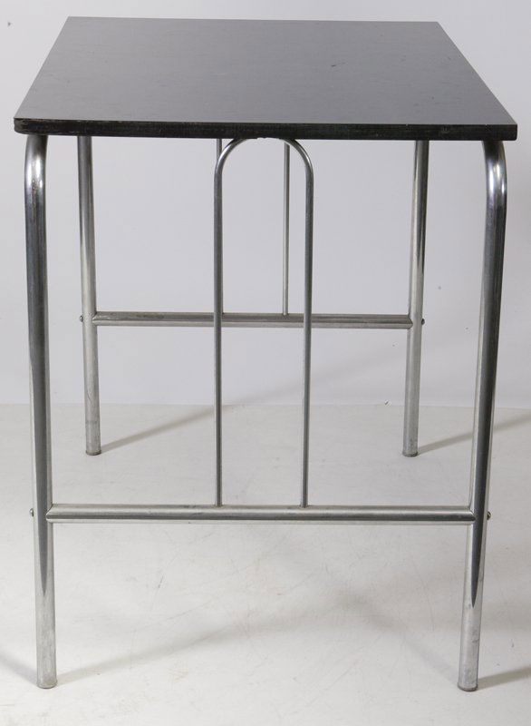 Vintage Art Deco Chrome Table: Rectangular form black Formica top over chrome frame with U-shaped side support attached to connecting chrome bracket on each side of the legs, 30"H x 30"W x 23.5"D. The surface top is scratched throu