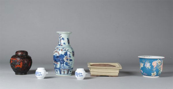 6 Pieces Chinese Decorative Objects: To include two miniature Chinese blue and white jars both signed, a famille rose jardiniere, a Chinese vase with bird and floral motif bearing a six character mark in underglaze blue, a footed stonewa