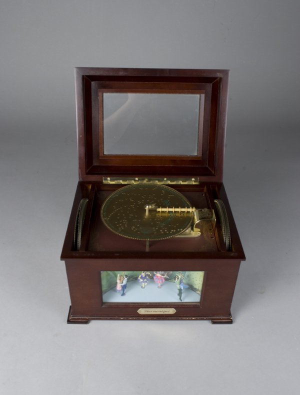 Harmonique Disc Music Box: Wood and glass music box featuring dancers in a shadow box on the front with 16 discs of Christmas music. Appears to be unplayed.