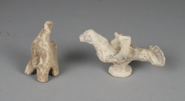 (2) Pottery Bird Figurines, Old Kingdom: One with remnants of original paint, probably a lamp, lacking part of beak and section of spout, 6" L. Other standing, possibly lacking head with remnants of pigment, 4.25" H. Assembled in the middle 