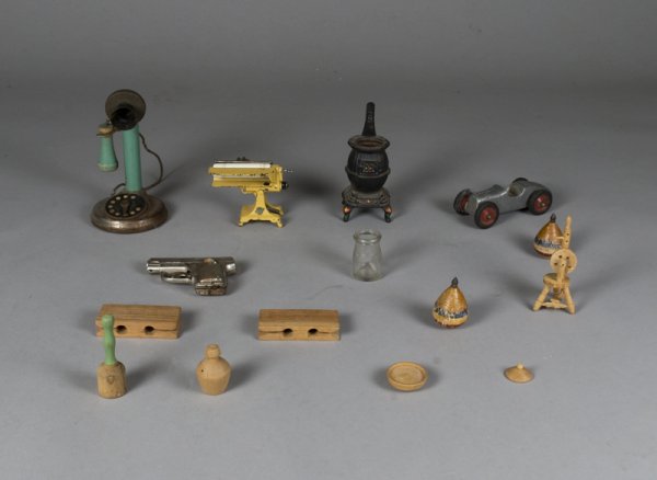 Collection of Children's Wooden and Metal Toys: Collection includes a wood and metal antique candlestick telephone, metal racecar, toy metal gun, spinning tops and more.