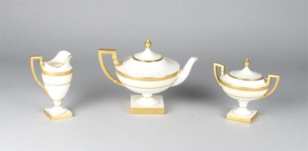 Exceptional (3) Piece Lenox Ivory Pedestal Tea Set: In the Napolianic style, richley gilded on square pedestals, with the early blue laural wreath made in the USA mark, each piece with painted in gilt no's 372-373-476, followed by S2A. All in mint cond