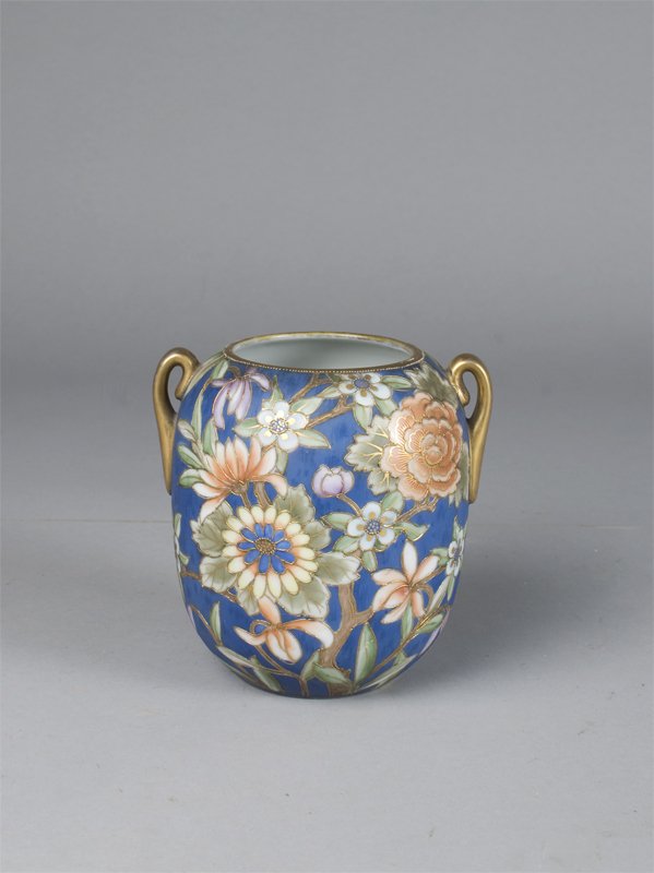 Nippon Moriage Decorated Vase With Two Handles: The vase with raised flowers against a blue ground with gilt highlights, green wreath mark, 5.75"H slight wear to gilt on bottom of one handle and inside of rim, a very nice vase.
