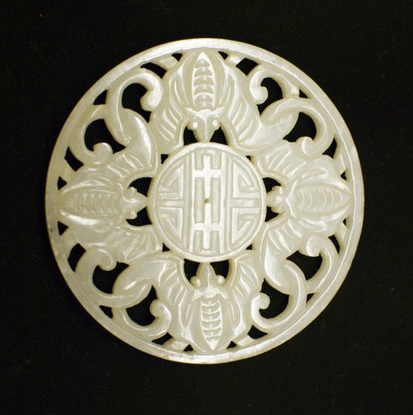 Chinese Qing Carved Jade Plaque: Carved to depict 4 bats surrounding a shou symbol, the stone almost a pure white. 2.625"D, 18th C. Provenance: Duk Soo Palace, Seoul Korea 1951. Estate of Lionel Hayes, a sargent in the 10th Marine Di